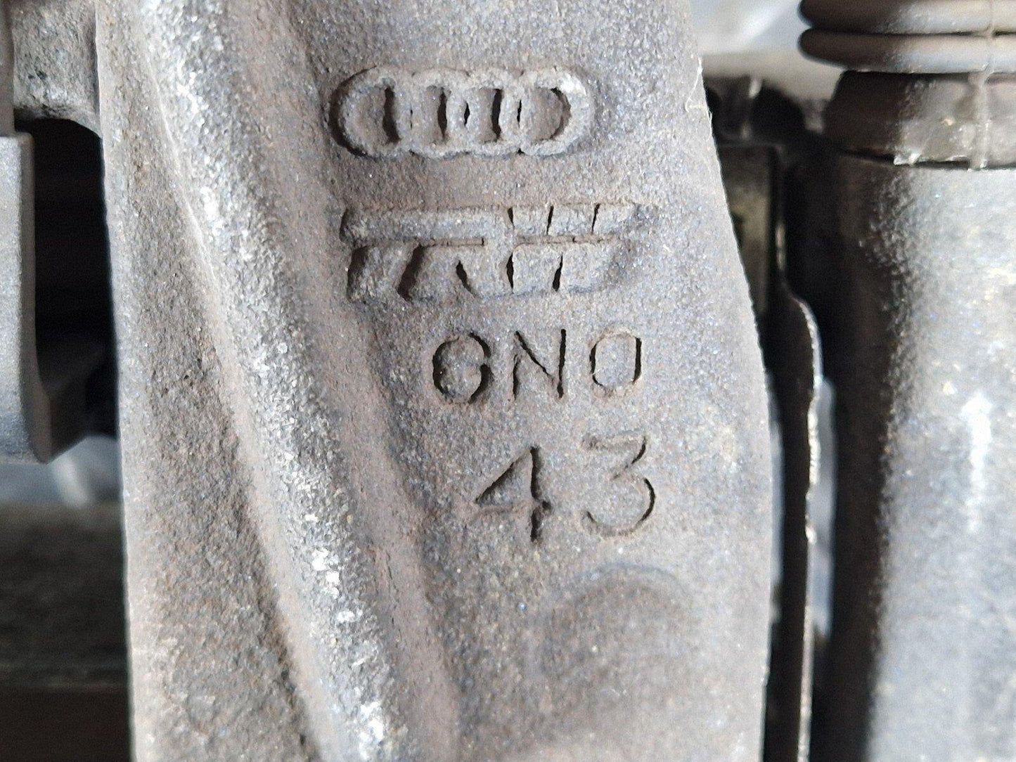 10-17 AUDI A8 4H REAR LEFT N/S BRAKE CALIPER HOUSING & MOTOR UNIT 4H0615403